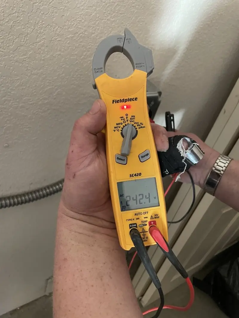 Voltage testing with clamp meter during Electrical Installation Services in Northumberland